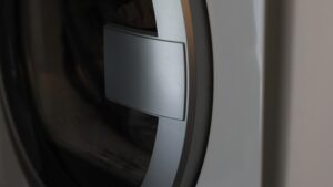 A close view of the door and drum opening of a front load washing machine